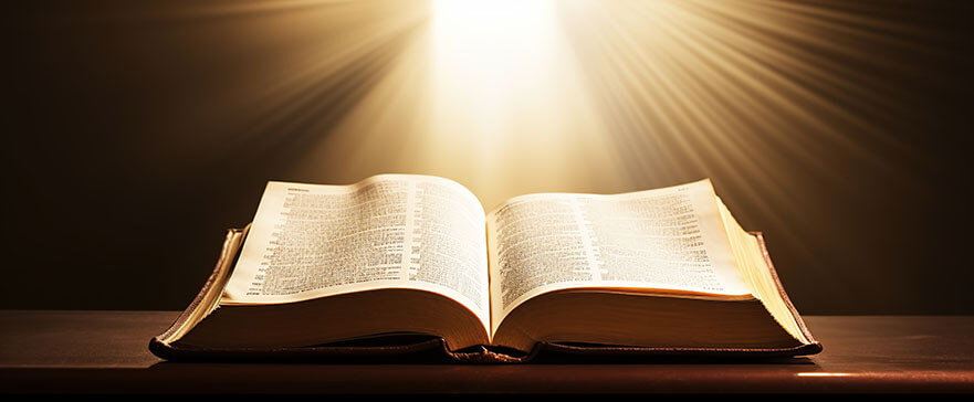 Open Holy bible book with glowing lights in church